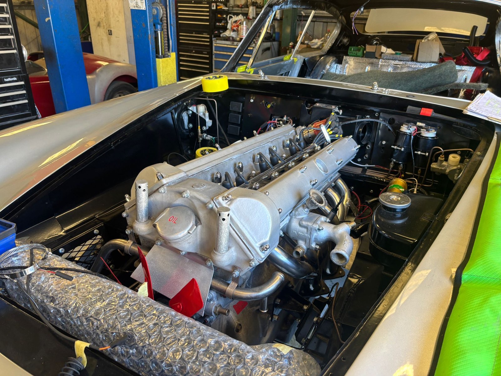 The Tadek Marek twin-cam in the engine bay, with its tubular exhaust manifolds.