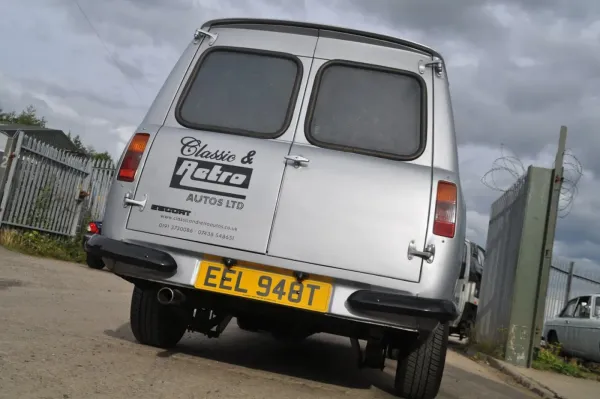 The workshop's sign-written van, registration EEL 948T